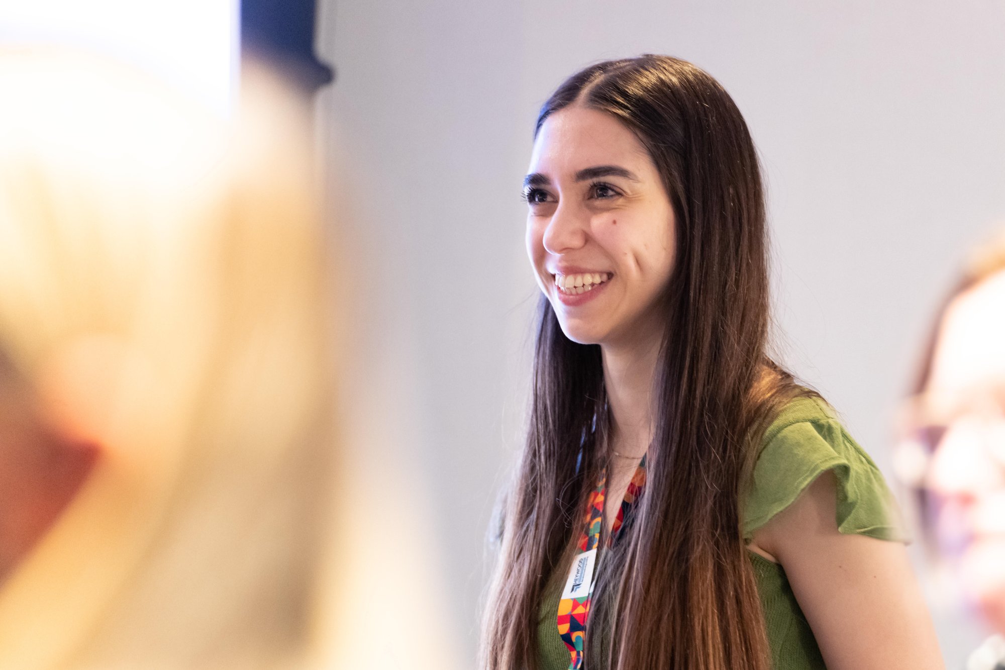 Smiling Heywood person at conference